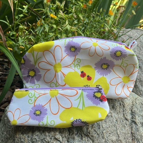 Clinique Handbags - Clinique Floral Pouch Set - Yellow and Purple
